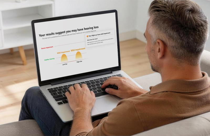 Adult Reviewing Audiogram Results Before Choosing Hearing Support