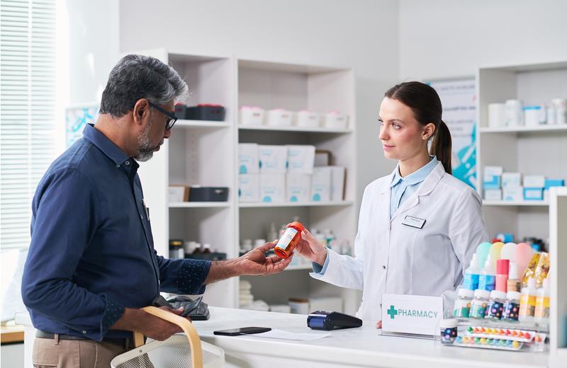 With Mild Hearing Loss Listening At A Pharmacy Counter